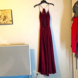 Used prom dress, medium-small, wine red, and has pockets.